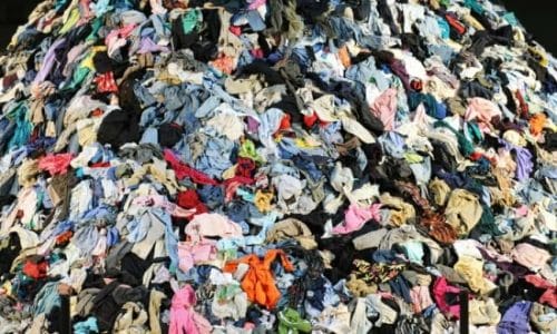 pile of clothing in a landfill