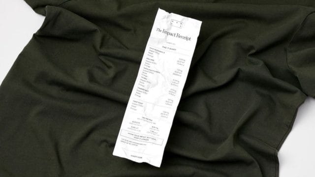 photo of ASKET t-shirt with the Impact Receipt laid over it.