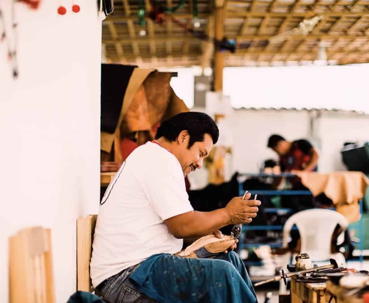 shoe maker in the workshop in Guatemala making shoes for Adelante