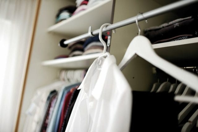 Hanging clothes in closet