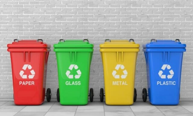 recycling bins for paper, glass, metal, and plastic