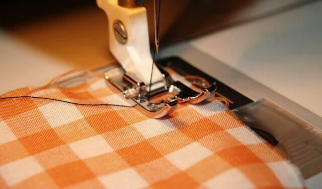 repairing old clothing on sewing machine