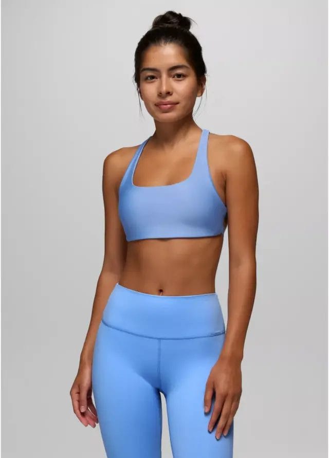 latina woman wearing blue prana activewear set of leggings and sports bra