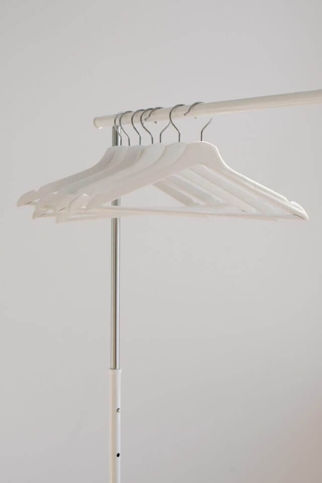 Empty clothing rail with hangers