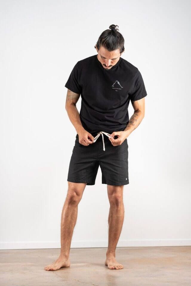 A model with Black Yoga shorts by Kozm