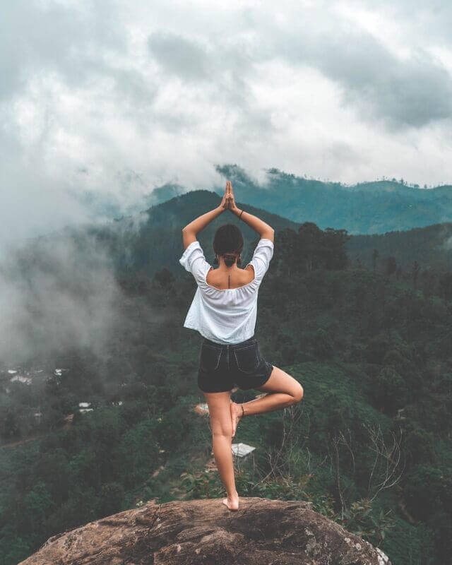 Yoga in mountains with smoke 