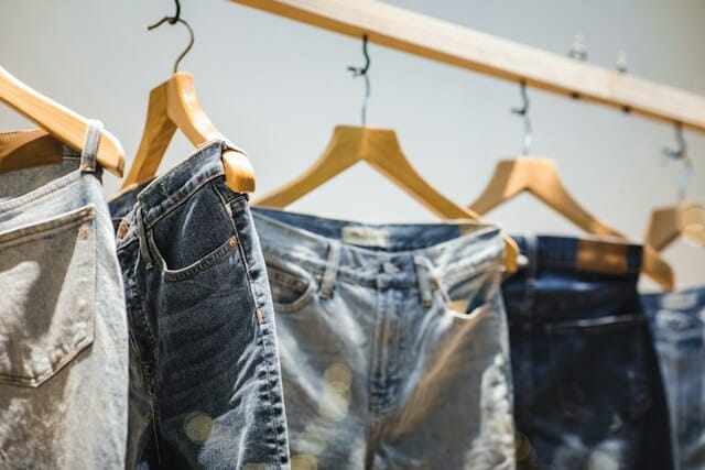 jeans hanging on a rack