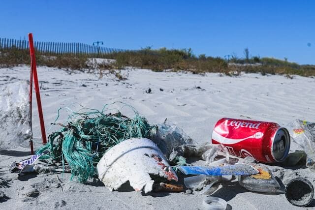 cleaning up trash on the beach