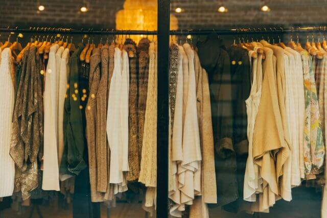 Clothes in a shop window - mostly jackets, coats, cardigans