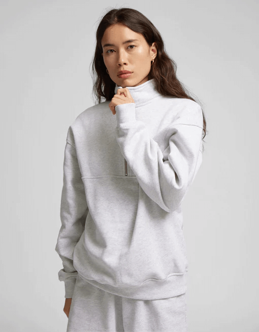 sustainable alternative to nasty gal: a model showcasing Colorful Standard sweater