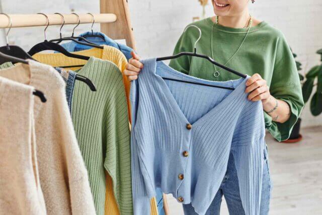 personal shopper selecting clothes for a client
