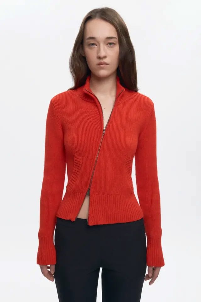 model wearing Asymmetric Zip Sweater in fiery red