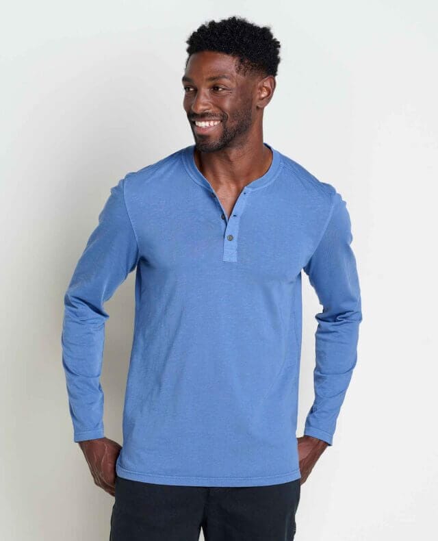 Model wearing the Men's Primo Long Sleeve Henley in blue by Toad&Co