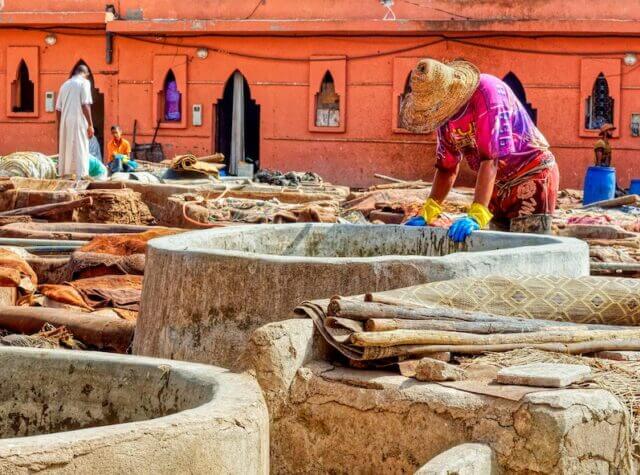 Worker in a tannery processing and treating skins of animals to produce leather