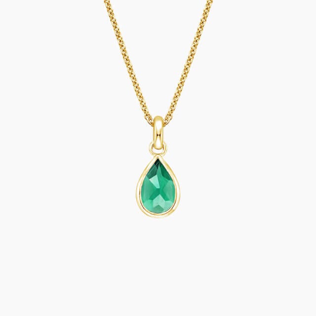 A necklace with a green pendant in gold.