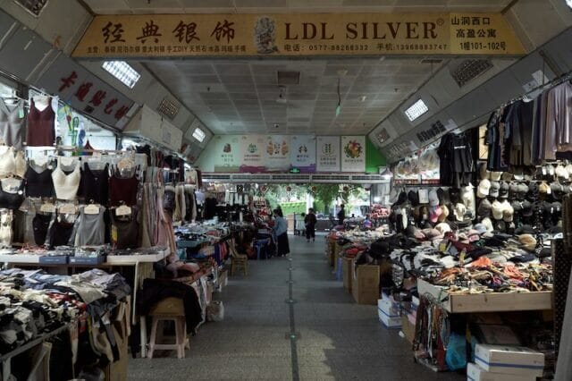 Illustrative image of a textile and accessory market of "Shein Village"