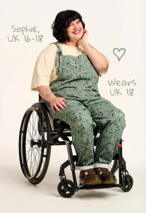 Model in wheelchair wearing Lucy & Yak petite dungarees, styled for individuals 5'2" and under.