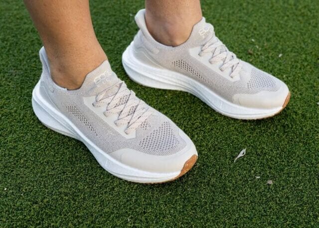 photo showing two feet wearing the runners hemp sneakers in beige by 8000kicks