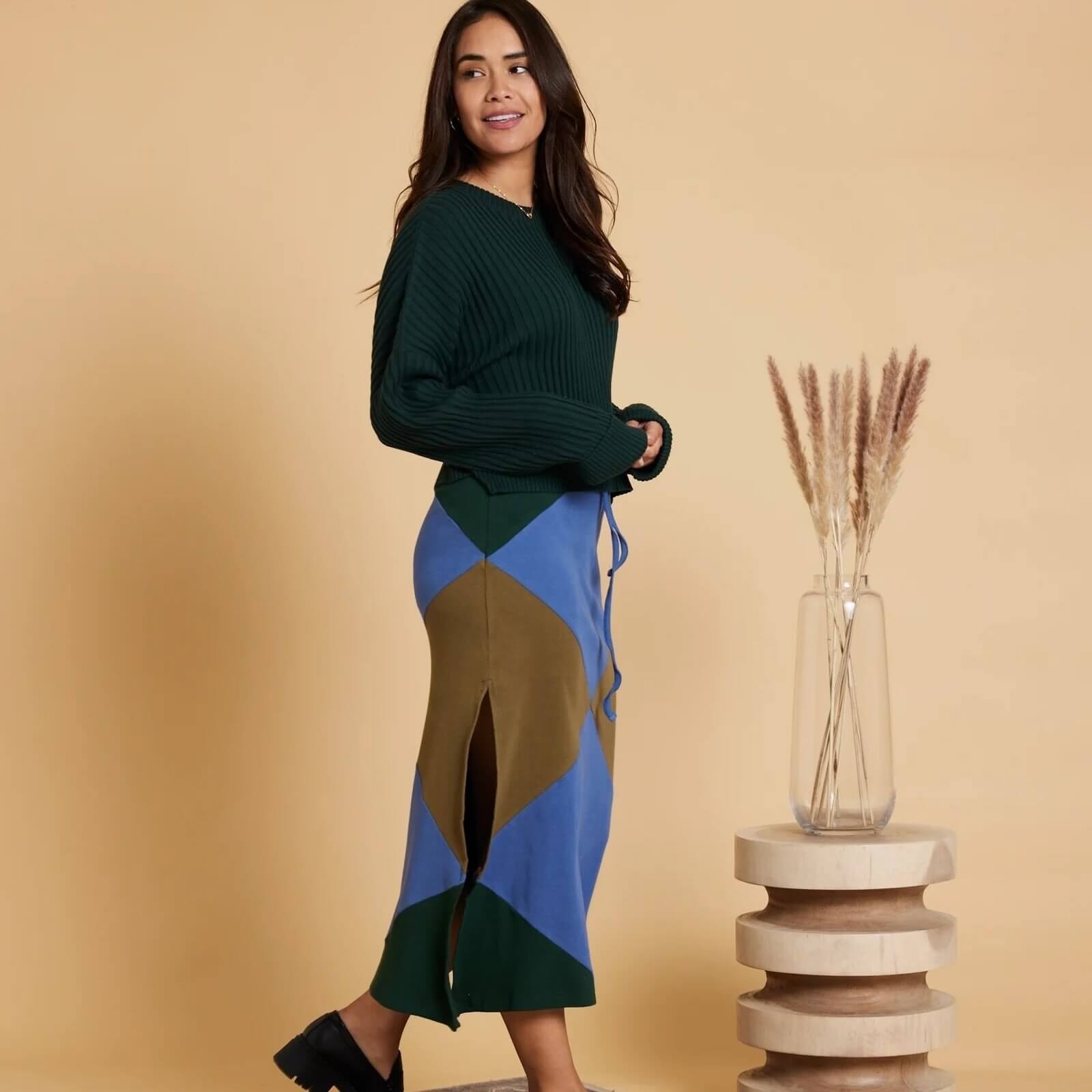 latina model wearing KNOWN SUPPLY skirt and top