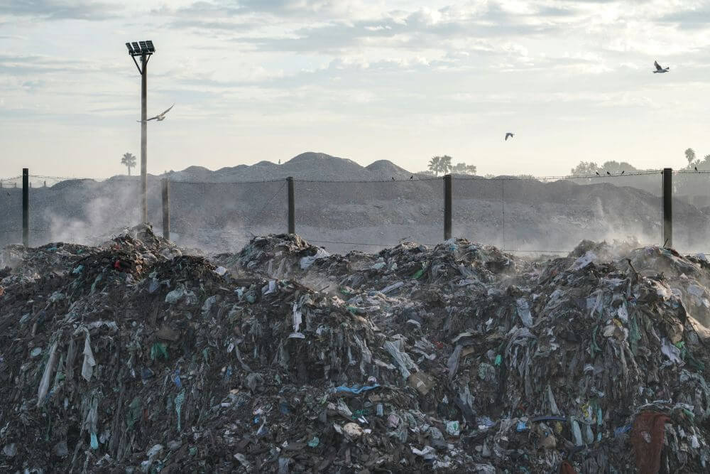 unsustainable, fast fashion in landfill